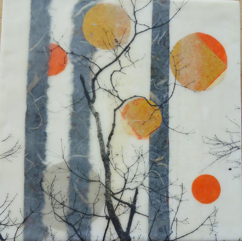 Black branches and tall gray forms layered beneath orange and yellow circles.